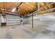 Large unfinished basement with concrete floor and shelving, providing ample storage or project space at 670 Dena Dr, Canton, GA 30114