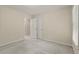 Neutral bedroom showcasing plush carpet, a window, and ample closet space at 670 Dena Dr, Canton, GA 30114