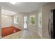 Bright breakfast nook with large windows, view to kitchen, and a door to deck at 670 Dena Dr, Canton, GA 30114