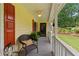 Inviting front porch with comfortable seating and vibrant plantings, offering a cozy welcome at 670 Dena Dr, Canton, GA 30114