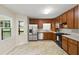 Traditional style kitchen with stainless steel appliances and view to backyard at 670 Dena Dr, Canton, GA 30114