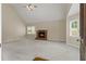 Bright living room with vaulted ceiling, fireplace, neutral carpet and lots of natural light at 670 Dena Dr, Canton, GA 30114