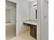 Bathroom featuring modern vanity with a granite countertop and a shower at 8683 Twin Oaks Dr, Jonesboro, GA 30236
