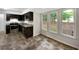 Well-lit kitchen with stainless steel appliances and dark cabinetry at 8683 Twin Oaks Dr, Jonesboro, GA 30236