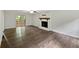 Spacious living room featuring hardwood floors and a sliding glass door to the deck at 8683 Twin Oaks Dr, Jonesboro, GA 30236