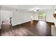 Open living room with hardwood floors, natural light, and access to the deck at 8683 Twin Oaks Dr, Jonesboro, GA 30236