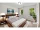 Bright bedroom with hardwood floors, stylish furniture, and plenty of natural light at 8683 Twin Oaks Dr, Jonesboro, GA 30236