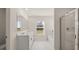 Bright bathroom with double vanity, soaking tub, and glass shower enclosure at 1288 Hollingsworth Way, Dacula, GA 30019