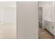 View from bedroom into bathroom with vinyl flooring, white vanity and shower/tub combo at 1288 Hollingsworth Way, Dacula, GA 30019
