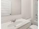 Clean bathroom featuring a white vanity, toilet, and shower-tub combo at 1288 Hollingsworth Way, Dacula, GA 30019