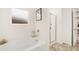 Clean bathroom featuring a tub and separate glass-enclosed shower with tile flooring at 1288 Hollingsworth Way, Dacula, GA 30019