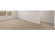 Carpeted bedroom showcasing a window with blinds and neutral-colored walls at 1288 Hollingsworth Way, Dacula, GA 30019