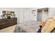 A bedroom featuring a stylish dark wood dresser, walk-in closet, and sports decor at 1288 Hollingsworth Way, Dacula, GA 30019