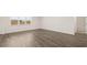 Neutral bedroom featuring white trim, natural light, and an adjacent bathroom at 1288 Hollingsworth Way, Dacula, GA 30019