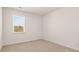 Carpeted bedroom featuring white trim, natural light, and clean design at 1288 Hollingsworth Way, Dacula, GA 30019