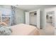 Tastefully decorated bedroom with floral curtains and open closet doors, revealing ample storage space at 1288 Hollingsworth Way, Dacula, GA 30019