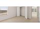 Spacious bedroom featuring carpet floors with a closet and white doors at 1288 Hollingsworth Way, Dacula, GA 30019