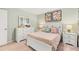 Charming bedroom with white furniture, floral curtains, soft bedding, and neutral paint at 1288 Hollingsworth Way, Dacula, GA 30019