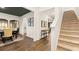Inviting dining area with hardwood floors, a decorative ceiling, and adjacent staircase at 1288 Hollingsworth Way, Dacula, GA 30019