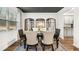 Dining room with rustic mirrors, contemporary rug, and views into the kitchen at 1288 Hollingsworth Way, Dacula, GA 30019