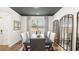 Dining area featuring lots of natural light, hardwood floors, and decorative mirrors at 1288 Hollingsworth Way, Dacula, GA 30019