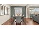 Dining room featuring hard wood floors, 6 chairs around wood table, and lots of natural light at 1288 Hollingsworth Way, Dacula, GA 30019