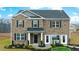 Charming two-story home with brick facade, black shutters, and well-manicured landscaping at 1288 Hollingsworth Way, Dacula, GA 30019