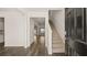 Bright entryway features hardwood-style floors and staircase at 1288 Hollingsworth Way, Dacula, GA 30019