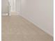 Hallway with neutral carpet and view down the hall at 1288 Hollingsworth Way, Dacula, GA 30019