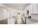 Modern kitchen featuring stainless appliances, granite countertops, and white cabinets at 1288 Hollingsworth Way, Dacula, GA 30019