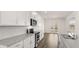 Kitchen showcases stainless appliances, granite countertops, and white cabinets at 1288 Hollingsworth Way, Dacula, GA 30019