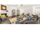 Spacious living room featuring a fireplace, decor shelves and cozy seating arrangements at 1288 Hollingsworth Way, Dacula, GA 30019