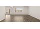Bright living area with hardwood floors and view to french doors to backyard at 1288 Hollingsworth Way, Dacula, GA 30019