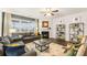 Inviting living room featuring a fireplace, ceiling fan, and comfortable seating area at 1288 Hollingsworth Way, Dacula, GA 30019