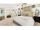 Spacious main bedroom with sitting area has a calming neutral color palette and decor at 1288 Hollingsworth Way, Dacula, GA 30019