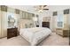 Relax in this spacious main bedroom with neutral colors, large windows, and decorative window treatments at 1288 Hollingsworth Way, Dacula, GA 30019