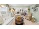 Sitting area of main bedroom provides a relaxing space with views to the sleeping area at 1288 Hollingsworth Way, Dacula, GA 30019