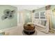 Bright sitting room area is the perfect space to relax and read a book at 1288 Hollingsworth Way, Dacula, GA 30019