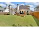 Spacious backyard with a well-maintained lawn and a charming deck area at 1294 Parkview Nw Ln, Kennesaw, GA 30152