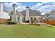 Well-maintained backyard featuring a lush lawn, deck, and cozy seating area for outdoor enjoyment at 1294 Parkview Nw Ln, Kennesaw, GA 30152