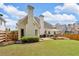 Beautiful backyard with a wood fence, lush green grass, and a deck that's perfect for entertaining at 1294 Parkview Nw Ln, Kennesaw, GA 30152