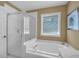 Bright bathroom showcasing the soaking tub and walk-in shower at 1294 Parkview Nw Ln, Kennesaw, GA 30152