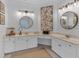 Bathroom featuring an expansive double vanity with two sinks, framed mirrors, and artwork at 1294 Parkview Nw Ln, Kennesaw, GA 30152