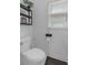 Powder room with decorative shelves and a window with bright, natural light at 1294 Parkview Nw Ln, Kennesaw, GA 30152