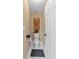 Narrow powder room featuring decor and a black toilet paper holder at 1294 Parkview Nw Ln, Kennesaw, GA 30152