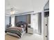 Bedroom featuring tray ceilings, light-blue walls, and two large windows at 1294 Parkview Nw Ln, Kennesaw, GA 30152
