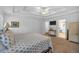 Main bedroom featuring a tray ceiling, neutral walls, and an en-suite bathroom at 1294 Parkview Nw Ln, Kennesaw, GA 30152