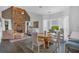 Open-concept dining area adjacent to the living room, featuring a wood table and bright windows at 1294 Parkview Nw Ln, Kennesaw, GA 30152