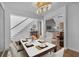 Elegant dining room with a modern chandelier, a staircase in view, and hardwood flooring at 1294 Parkview Nw Ln, Kennesaw, GA 30152