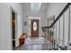 Inviting foyer featuring hardwood floors, staircase, and natural light, creating a warm ambiance at 1294 Parkview Nw Ln, Kennesaw, GA 30152